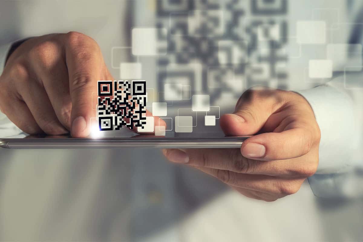 QR code scanning on a smartphone, digital technology concept.